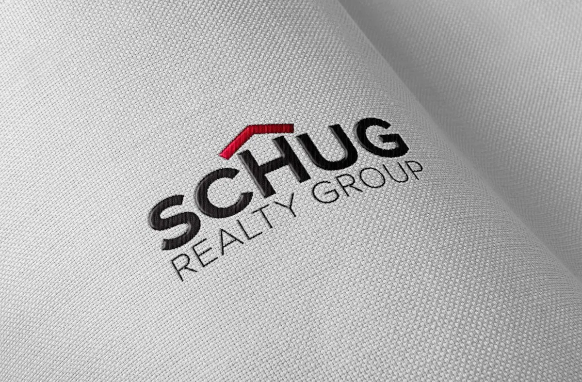 Schug Realty Group logo embroidered on fabric